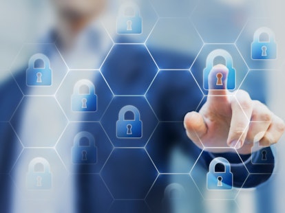 Security Consultant Touching Network of Lock Icons on Virtual Screen